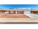 Inviting single-story home with a red brick facade, well-kept yard, and attached garage on a sunny day at 4310 E Sacaton St, Phoenix, AZ 85044
