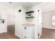 Hallway area featuring a built-in storage cabinet with shelving and butcher block top at 4310 E Sacaton St, Phoenix, AZ 85044
