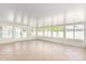Bright sun room features tile flooring and numerous windows offering lots of natural light at 4310 E Sacaton St, Phoenix, AZ 85044