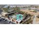 Aerial view of a pool and surrounding area, with palm trees and lots of lounge chairs at 4512 S Ferric Ave, Mesa, AZ 85212