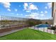 The property features a fenced pool, landscaping, and an artificial lawn area at 4512 S Ferric Ave, Mesa, AZ 85212