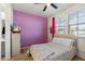 This bedroom offers a ceiling fan, a TV, and a window letting in plenty of natural light at 4512 S Ferric Ave, Mesa, AZ 85212