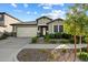 Charming single-story home with a well-maintained front yard and neutral-colored facade at 4512 S Ferric Ave, Mesa, AZ 85212