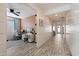 Hallway with wood-look tile flooring leading to home office with accent wall paint at 4512 S Ferric Ave, Mesa, AZ 85212