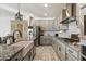 Modern kitchen features gray cabinets, granite countertops, and stainless steel appliances at 4512 S Ferric Ave, Mesa, AZ 85212