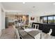 Open concept living area, seamlessly connecting the dining area and modern kitchen at 4512 S Ferric Ave, Mesa, AZ 85212