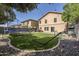 Spacious backyard featuring artificial turf, trampoline, hammock and plenty of room for activities at 45543 W Guilder Ave, Maricopa, AZ 85139