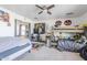Spacious bedroom featuring a ceiling fan and bunk beds, offering versatile living arrangements at 45543 W Guilder Ave, Maricopa, AZ 85139