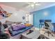 Cozy bedroom with a blue accent wall and desk space, providing a comfortable and functional area at 45543 W Guilder Ave, Maricopa, AZ 85139