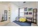 Cozy bonus room with beanbag chairs and playful art, perfect for relaxing or creative activities at 45543 W Guilder Ave, Maricopa, AZ 85139