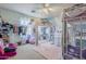 Whimsical bedroom features a unique bunk bed, a cozy pink rug, and creative decor for a playful space at 45543 W Guilder Ave, Maricopa, AZ 85139