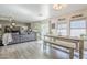 Open dining and living area with ample natural light and cozy furniture at 45543 W Guilder Ave, Maricopa, AZ 85139