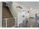 Entryway featuring stairs, a desk, and ample space for storage, offering a functional and organized welcome at 45543 W Guilder Ave, Maricopa, AZ 85139