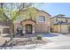 Charming two-story home featuring a spacious driveway, covered porch, and low-maintenance front yard at 45543 W Guilder Ave, Maricopa, AZ 85139