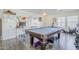 Game room with a pool table, dedicated desk space, and plenty of natural light creating a versatile area at 45543 W Guilder Ave, Maricopa, AZ 85139