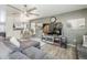 Cozy living room showcases stylish seating, TV, and eye-catching wall decorations at 45543 W Guilder Ave, Maricopa, AZ 85139