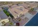 Aerial view of home with a sparkling pool, putting green, and desert landscaping at 4615 S Primrose Dr, Gold Canyon, AZ 85118