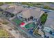 Inviting backyard with pool, putting green, and lush desert landscaping at 4615 S Primrose Dr, Gold Canyon, AZ 85118
