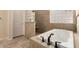 Bright bathroom with a soaking tub, glass-blocked shower and updated fixtures; perfect for relaxing at 4615 S Primrose Dr, Gold Canyon, AZ 85118