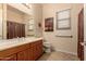 Bathroom featuring a vanity, a mirror, a toilet, a window, and a shower with a curtain at 4615 S Primrose Dr, Gold Canyon, AZ 85118