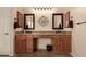 Dual sinks and dark wood cabinets highlight this spacious bathroom with tile flooring and modern lighting at 4615 S Primrose Dr, Gold Canyon, AZ 85118