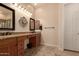 Well-lit bathroom with granite countertops, double sinks, and traditional-style cabinetry at 4615 S Primrose Dr, Gold Canyon, AZ 85118