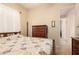 Bedroom featuring a bed, a window, a dresser, and view to hallway at 4615 S Primrose Dr, Gold Canyon, AZ 85118