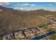 Scenic aerial view showcases homes nestled against a desert mountain backdrop at 4615 S Primrose Dr, Gold Canyon, AZ 85118