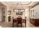 Inviting dining room with a stylish chandelier, tray ceiling, and natural light at 4615 S Primrose Dr, Gold Canyon, AZ 85118