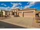 Spacious home with a three-car garage and a well-maintained driveway at 4615 S Primrose Dr, Gold Canyon, AZ 85118