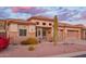 Charming home featuring desert landscaping, stone accents, a tile roof, and a well-manicured front yard at 4615 S Primrose Dr, Gold Canyon, AZ 85118