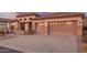 Charming home featuring desert landscaping, stone accents, a tile roof, and a two-car garage at 4615 S Primrose Dr, Gold Canyon, AZ 85118