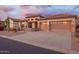 Charming home featuring desert landscaping, stone accents, a tile roof, and a two-car garage at 4615 S Primrose Dr, Gold Canyon, AZ 85118