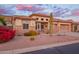Charming home featuring desert landscaping, stone accents, a tile roof, and a well-manicured front yard at 4615 S Primrose Dr, Gold Canyon, AZ 85118