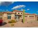 Charming single-story home featuring desert landscaping, a tile roof, and a three-car garage at 4615 S Primrose Dr, Gold Canyon, AZ 85118