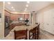 Kitchen featuring stainless steel appliances, granite counters, island with seating, and neutral cabinetry at 4615 S Primrose Dr, Gold Canyon, AZ 85118