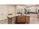 Island kitchen with granite countertops, stainless steel appliances, and an open-concept to the dining area at 4615 S Primrose Dr, Gold Canyon, AZ 85118