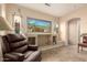 Beautiful living room with tile floors, recessed lighting, and large windows displaying desert views at 4615 S Primrose Dr, Gold Canyon, AZ 85118