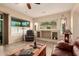 Inviting living room with comfortable leather furniture, large windows, and tile flooring at 4615 S Primrose Dr, Gold Canyon, AZ 85118