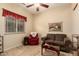 Living room featuring tile flooring, a ceiling fan, a window, and comfortable seating furniture at 4615 S Primrose Dr, Gold Canyon, AZ 85118