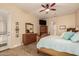 Comfortable main bedroom with warm tones, tile floors, and a vintage wooden bed frame at 4615 S Primrose Dr, Gold Canyon, AZ 85118