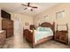 A bright main bedroom features traditional furnishings, tile floors, and stained glass windows at 4615 S Primrose Dr, Gold Canyon, AZ 85118