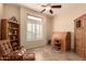 Cozy office space featuring a ceiling fan, shuttered windows, and warm neutral tones at 4615 S Primrose Dr, Gold Canyon, AZ 85118