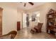 Versatile office space featuring a ceiling fan, neutral tones, and an open doorway at 4615 S Primrose Dr, Gold Canyon, AZ 85118