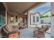 Inviting covered patio with stylish seating area, ideal for relaxing or entertaining guests, under a sunny blue sky at 4615 S Primrose Dr, Gold Canyon, AZ 85118
