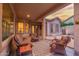 Inviting covered patio with stylish seating area, ideal for relaxing or entertaining guests, under a sunset colored sky at 4615 S Primrose Dr, Gold Canyon, AZ 85118