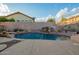 Backyard pool with rock waterfall feature and desert landscaping at 4615 S Primrose Dr, Gold Canyon, AZ 85118