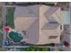 Aerial view of the home's tile roof, backyard pool and putting green at 4615 S Primrose Dr, Gold Canyon, AZ 85118