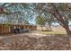 Spacious backyard with artificial turf, desert landscaping, covered patio, and outdoor seating area at 5137 N 20Th Ave, Phoenix, AZ 85015