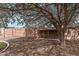 Private backyard featuring mature trees, desert landscaping and chicken coop at 5137 N 20Th Ave, Phoenix, AZ 85015